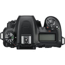 Top view of Nikon D7500 DSLR camera with 18-140mm lens showing control dials and LCD screen