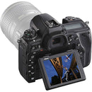 Nikon D780 DSLR camera with tilting LCD screen displaying basketball action shot