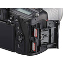 Close-up of Nikon D780 DSLR camera showing dual SanDisk memory card slots and rear controls