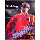 Man in orange jumpsuit and goggles holding keyboard at Sled Island Music & Arts Festival