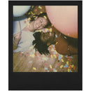 Polaroid Originals i-Type Colour Film black frame instant photo of two people with balloons and confetti