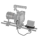 SmallRig NP-F Battery Plate with charging cables mounted on BMPCC 4K camera rig for extended power and battery status indicators