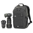 Thinktank BackStory 13 camera backpack with rear-panel opening, laptop and tablet compartments, and tripod attachment.